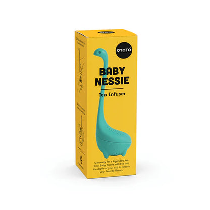 Yellow box with a blue Nessie-shaped tea infuser on a white background
